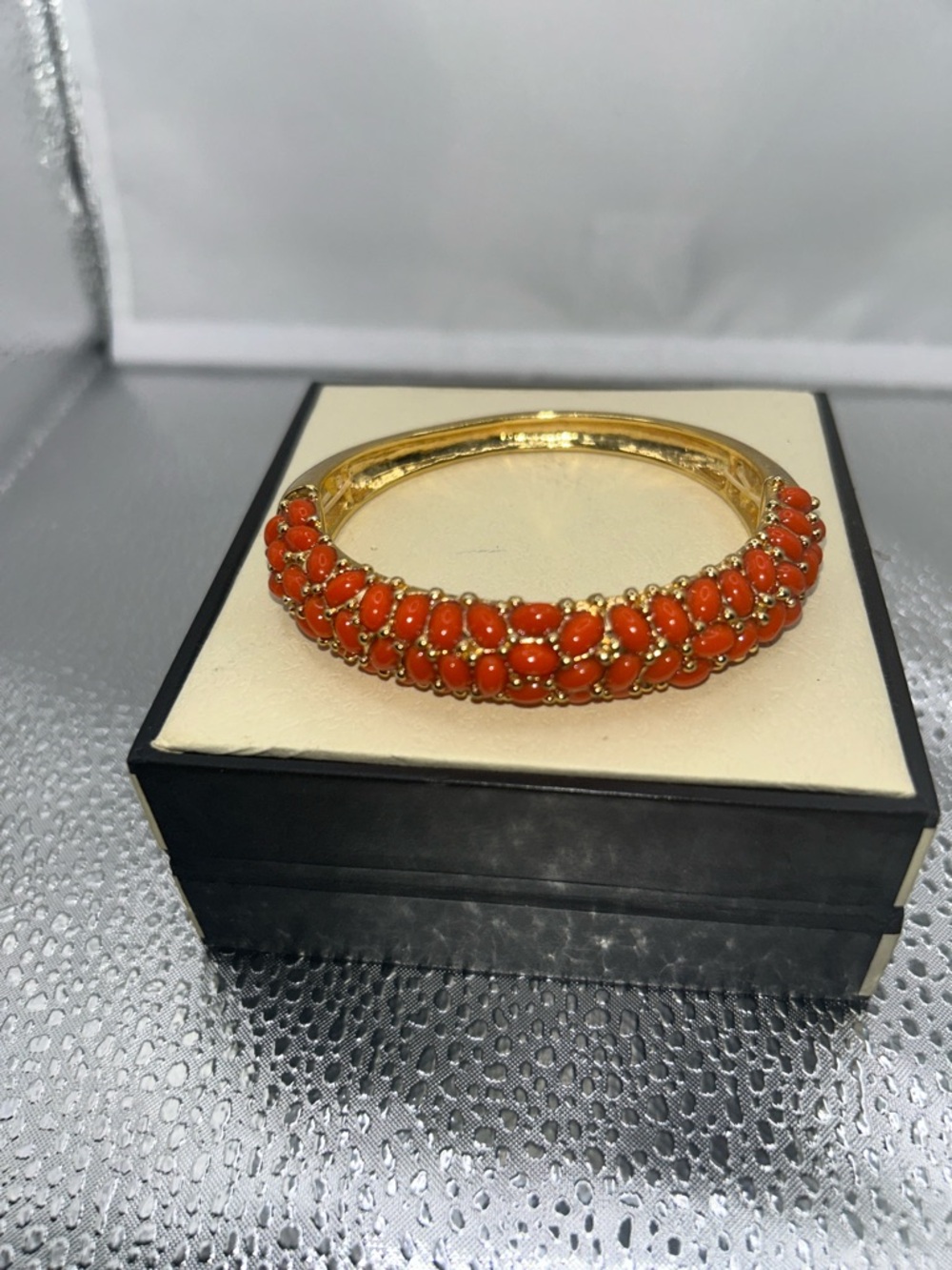 Gold tone bangle bright coral colored beads beaded texture slip on polished